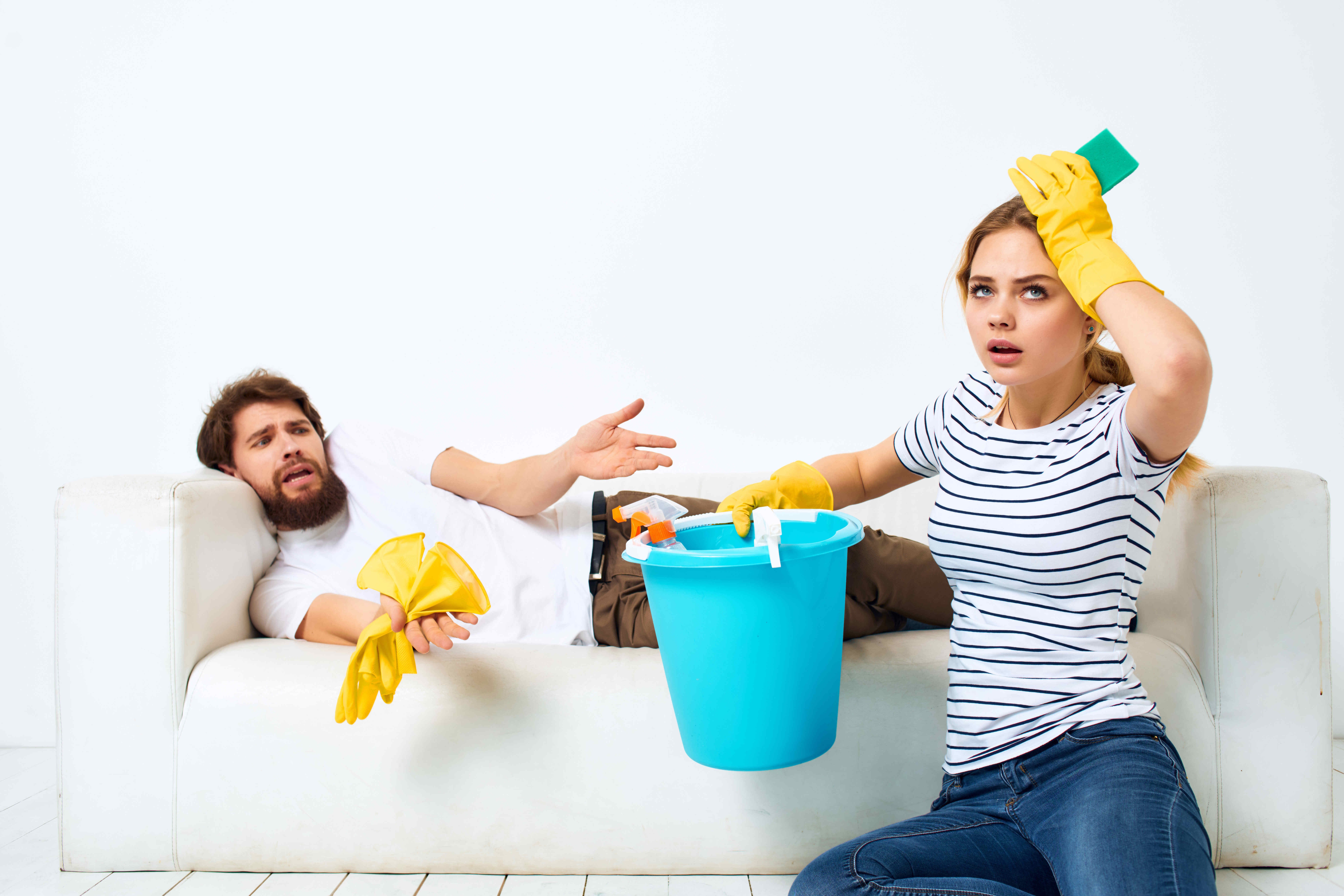 married-couple-near-the-sofa-cleaning-of-the-apart-2023-11-27-05-36-20-utc